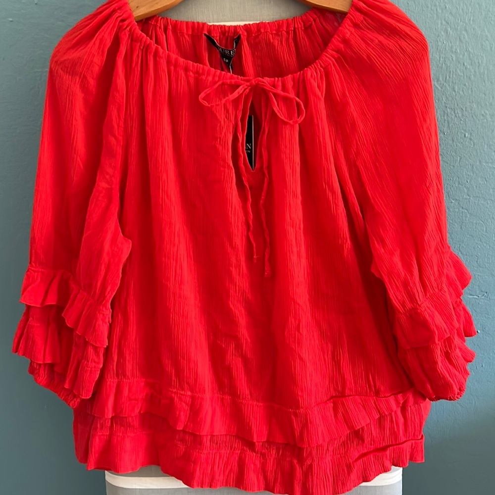 Ralph Lauren. It’s a S/P but the size runs very big.